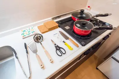 a kitchen counter with a stove with a pot on it at unito \u9053\u7384\u5742\u90b8\u5b85 in Tokyo