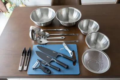 a group of utensils on a table with bowls at \u30d6\u30e9\u30f3\u30d9\u30fc\u30b9\u6771\u4eac\u516d\u7fa9\u5712 ss in Tokyo
