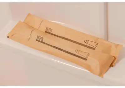 a paper bag sitting on top of a shelf at Lido Alba in Tokyo