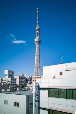 a view of the eiffel tower in a city at Oshiage Sta U-Court Kinshicho in Tokyo