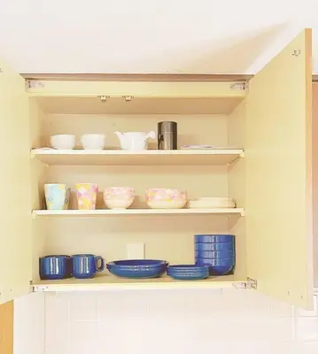 a shelf with bowls and other dishes on it at U-Court Kinshicho 3F in Tokyo