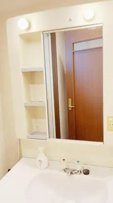 a bathroom with a mirror over a bathroom sink at U-Court Kinshicho 3F in Tokyo