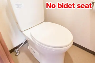 a white toilet in a bathroom with a no bidet seat at Belmont 101 3min to Station Easy Access Ueno Asakusa Skytree Sleeps 5 in Tokyo
