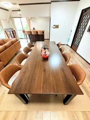 a large wooden table in a room with chairs at \u6c60\u888b\u99c5\u307e\u3067\u96fb\u8eca\u30677\u5206 4LDK98m2 in Tokyo