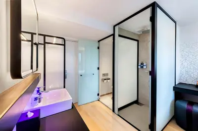 a bathroom with a sink and a mirror at YOTEL Tokyo Ginza in Tokyo