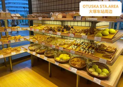 a bakery with lots of different types of bread and pastries at COMMA HOUSE Otsuka 201 in Tokyo
