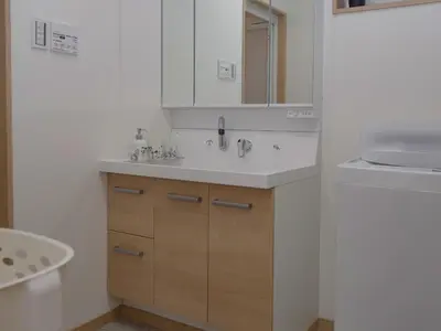 a bathroom with a white sink and a mirror at City Pal Sakurashinmachi - Vacation STAY 17738 in Tokyo