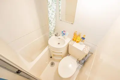 a small bathroom with a toilet and a sink at \u65b0\u5bbf\u6b4c\u821e\u4f0e\u753a\u7e41\u534e\u5546\u4e1a\u533a\u514d\u8d39Wi-Fi#9 in Tokyo