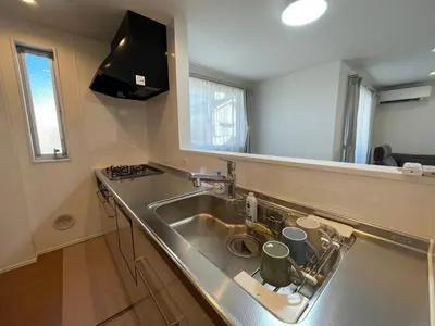 a kitchen with a sink and a counter top at Starry Ocean in Tokyo