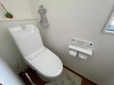 a bathroom with a white toilet in a room at Starry Ocean in Tokyo