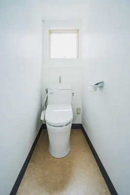 a white toilet in a bathroom with a window at Streamer \u685c\u4e18\u753a House Shibuya station in Tokyo