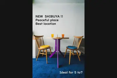 a table with three chairs and a purple table andools at Streamer \u685c\u4e18\u753a House Shibuya station in Tokyo