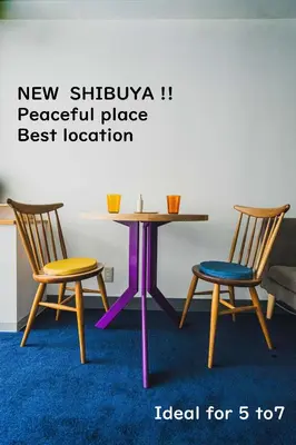 a table and two chairs in a room at Streamer \u685c\u4e18\u753a House Shibuya station in Tokyo