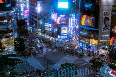 a busy city street at night with neon signs at NEW! Downtown Shibuya Prime Unit, Perfect location in Tokyo