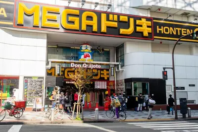 a store on a street corner with people standing outside at NEW! Downtown Shibuya Prime Unit, Perfect location in Tokyo