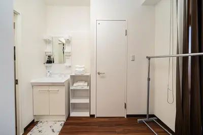 a bathroom with a sink and a mirror at Momostay Skytree\u524d\u4f11\u696d\u4e2d in Tokyo
