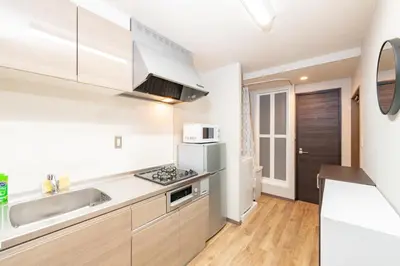 a kitchen with a sink and a counter top at \u6d45\u8349\u30a2\u30d1\u30fc\u30c8\u30e1\u30f3\u30c8301 in Tokyo