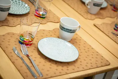a table with two plates and two cups and utensils at \u677e\u304c\u8c37\u30a2\u30d1\u30fc\u30c8\u30e1\u30f3\u30c8201 in Tokyo