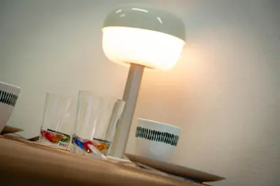 a lamp on a shelf with glasses on it at \u677e\u304c\u8c37\u30a2\u30d1\u30fc\u30c8\u30e1\u30f3\u30c8201 in Tokyo
