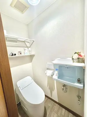 a small bathroom with a toilet and a sink at KOBAYASHi \u6771\u4eac in Tokyo