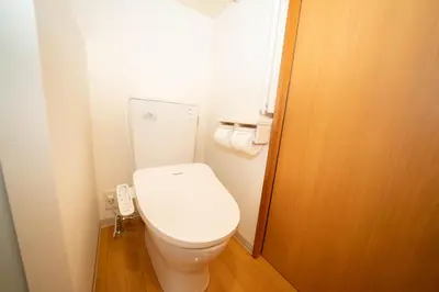 a bathroom with a toilet with a phone next to it at \u677e\u304c\u8c37\u30a2\u30d1\u30fc\u30c8\u30e1\u30f3\u30c8301 in Tokyo