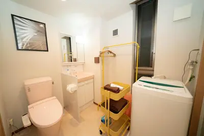 a small bathroom with a toilet and a sink at \u677e\u304c\u8c37\u30a2\u30d1\u30fc\u30c8\u30e1\u30f3\u30c8101 in Tokyo