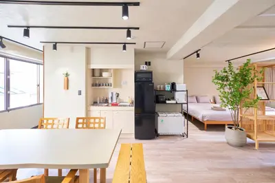 a kitchen and living room with a table and chairs at ACOE M O R I S H I T A - Direct Access to Tokyo Attractions in Tokyo
