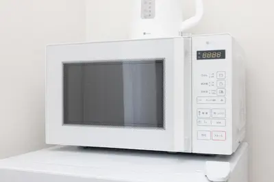 a microwave oven sitting on top of a counter at Prim Square, 8min walk to Shibuya Sta in Tokyo