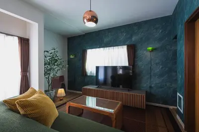 a living room with a couch and a flat screen tv at House YOYOGI Park, Shibuya Area, 4 Minutes to Yoyogi Park, 4-Bedroom, Sleeps 8 in Tokyo