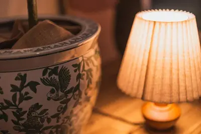 a pot sitting on a table next to a lamp at House YOYOGI Park, Shibuya Area, 4 Minutes to Yoyogi Park, 4-Bedroom, Sleeps 8 in Tokyo