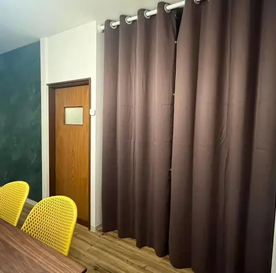 a curtain in a room with a table and chairs at House YOYOGI Park, Shibuya Area, 4 Minutes to Yoyogi Park, 4-Bedroom, Sleeps 8 in Tokyo