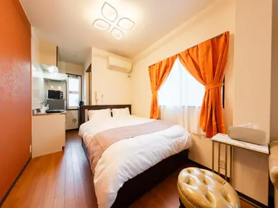 a bedroom with a large bed and a window at \u6d45\u8349\u99c5\u5f92\u6b694\u5206,\u6d45\u8349\u5bfa8\u5206,\u4e0a\u91ce\u99c55\u5206,\u30ab\u30c3\u30d1\u6a4b\u9053\u5177\u88574\u5206,Switch,Wi-Fi in Tokyo