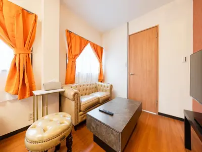 a living room with a couch and a table at \u6d45\u8349\u99c5\u5f92\u6b694\u5206,\u6d45\u8349\u5bfa8\u5206,\u4e0a\u91ce\u99c55\u5206,\u30ab\u30c3\u30d1\u6a4b\u9053\u5177\u88574\u5206,Switch,Wi-Fi in Tokyo