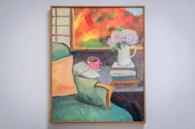 a painting of a couch with a vase of flowers at Sumida River Temple Villa in Tokyo
