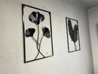 two framed pictures of flowers on a wall at COMMA HOUSE Otsuka 3-1 in Tokyo