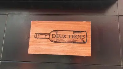 a sign with a glass bottle with the words blowitious at new!\u9580\u524d\u4ef2\u753a \u8d8a\u4e2d\u5cf6\u304b\u3089\u5f92\u6b695\u5206! \u9280\u5ea7 \u6d45\u8349 \u30b9\u30ab\u30a4\u30c4\u30ea\u30fc \u7bc9\u5730 \u8c4a\u6d32 \u821e\u6d5c\u3078\u30a2\u30af\u30bb\u30b9\u826f\u597d in Tokyo