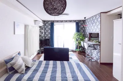 a bedroom with a bed and a desk in a room at Dain Hostel1 in Tokyo