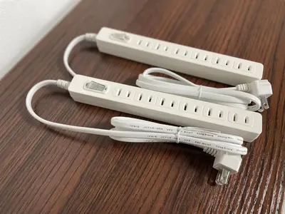 two nintendo wii controllers sitting on a wooden table at COMMA HOUSE Otsuka 4-1 in Tokyo