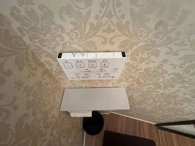 a machine on a wall in a room with a wall at shinjyuku area 602 in Tokyo