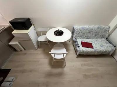 a small living room with a table and a chair at shinjyuku area 602 in Tokyo