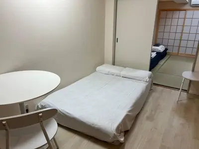 a small room with a bed and a table at shinjyuku area 602 in Tokyo