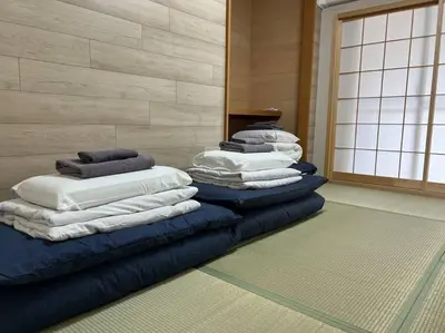 a stack of pillows are lined up in a room at shinjyuku area 602 in Tokyo