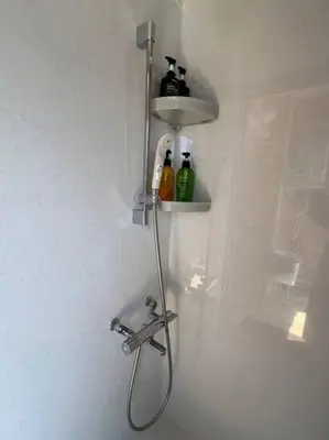 a shower with a sink and a faucet in a bathroom at Shinjyuku area 603 in Tokyo