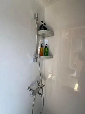 a shower with a faucet and a sink in a bathroom at Shinjyuku area 603 in Tokyo