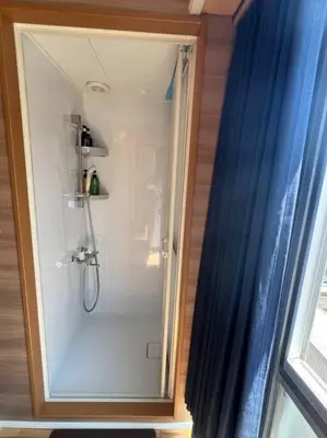 a shower with a glass door in a bathroom at Shinjyuku area 603 in Tokyo