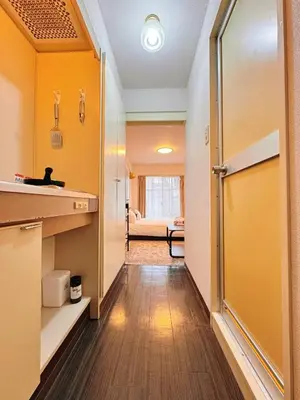 a hallway with a door leading into a room at Home Story in Tokyo Kanamachi&東京屋語 in Tokyo