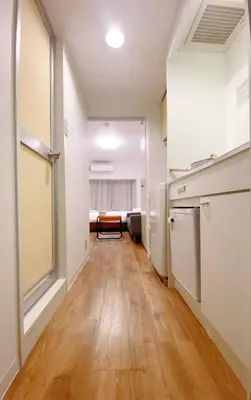 a hallway with a kitchen and a living room at Home Story in Tokyo Kanamachi&東京屋語 in Tokyo