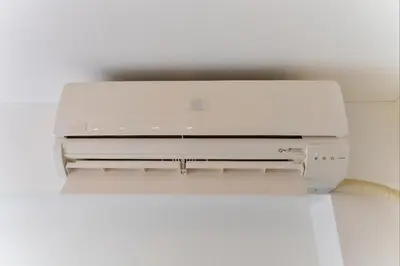 a white laptop computer sitting on top of a printer at shinjuku kabukicho 601 in Tokyo