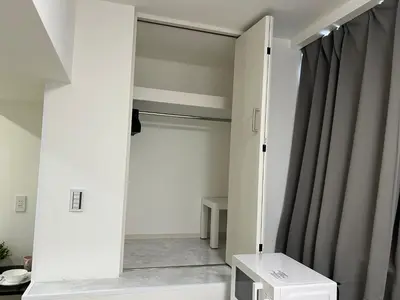 a closet with a mirror in a room at Ikebukuro Area R1 NishiikeApartment 5F No Elevator in Tokyo