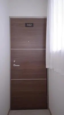 a wooden door in a room with a window at City Pal Sakurashinmachi - Vacation STAY 17753 in Tokyo